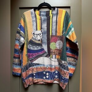 Yesno brand women's sweater featuring a graphic of a polar bear knitting Large